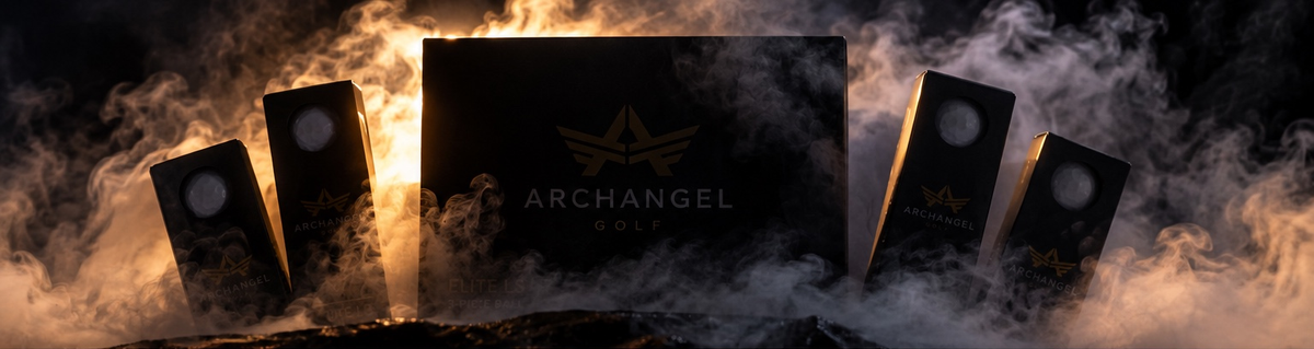 Archangel Golf ball packaging partially hidden in smoke with warm gold lighting